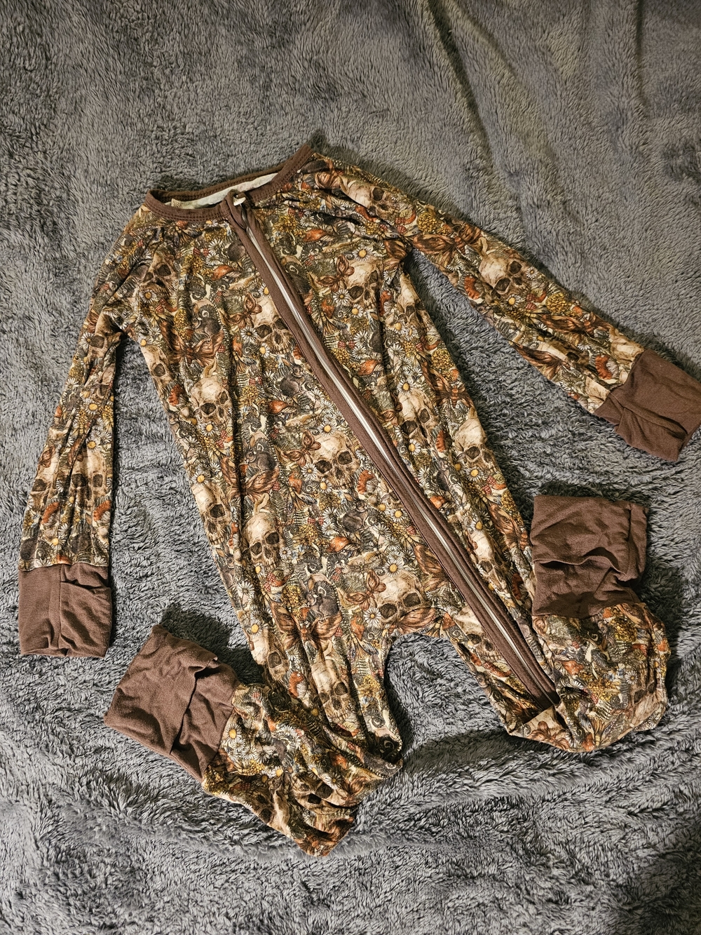 The Stork Boutique 3T Brown Skulls And Nature Onesie